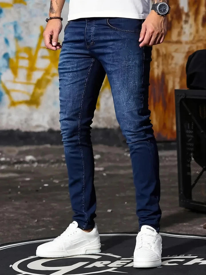 A set of three men's slim-fit jeans in multiple colors, including black, dark blue, and light blue, designed to fit the body sha